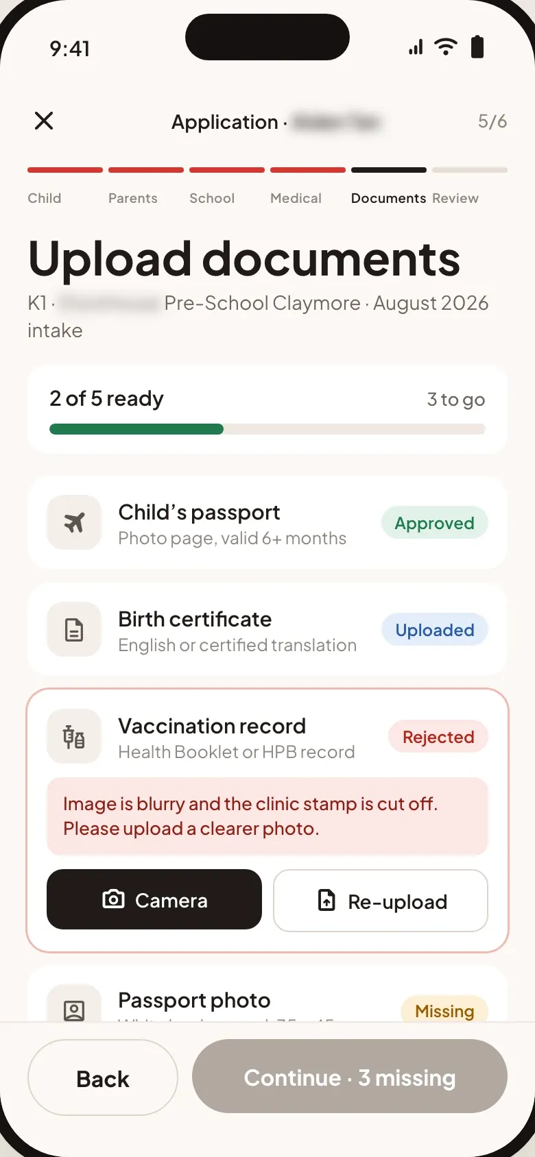 Application step five of six with two of five documents ready: a passport approved, a birth certificate uploaded, a vaccination record rejected with the reason above camera and re-upload buttons, and a passport photo missing